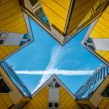 Looking up through the iconic yellow Cube Houses (Kubuswoningen) in Rotterdam, Netherlands