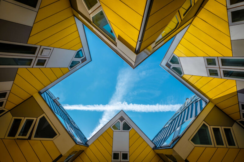 Looking up through the iconic yellow Cube Houses (Kubuswoningen) in Rotterdam, Netherlands